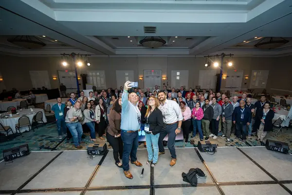SGT employees gathered for a group photo at a company event
