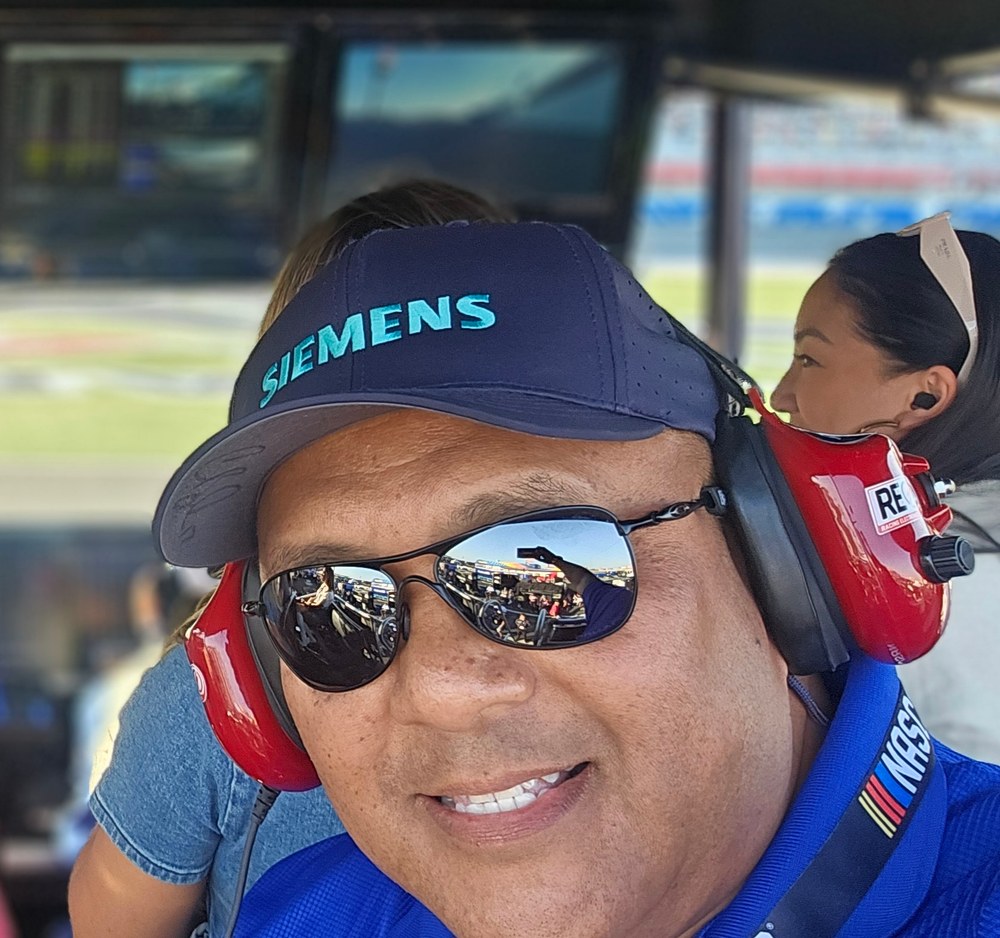 Rey Rasco wearing a Siemens cap at the track